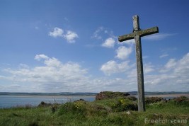 Picture of a wooden Christian cross on Saint Cuthberts Isle, Holy Island, Northumberland. St Cuthberts Isle was a small island used as a retreat by both Aidan and Cuthbert.