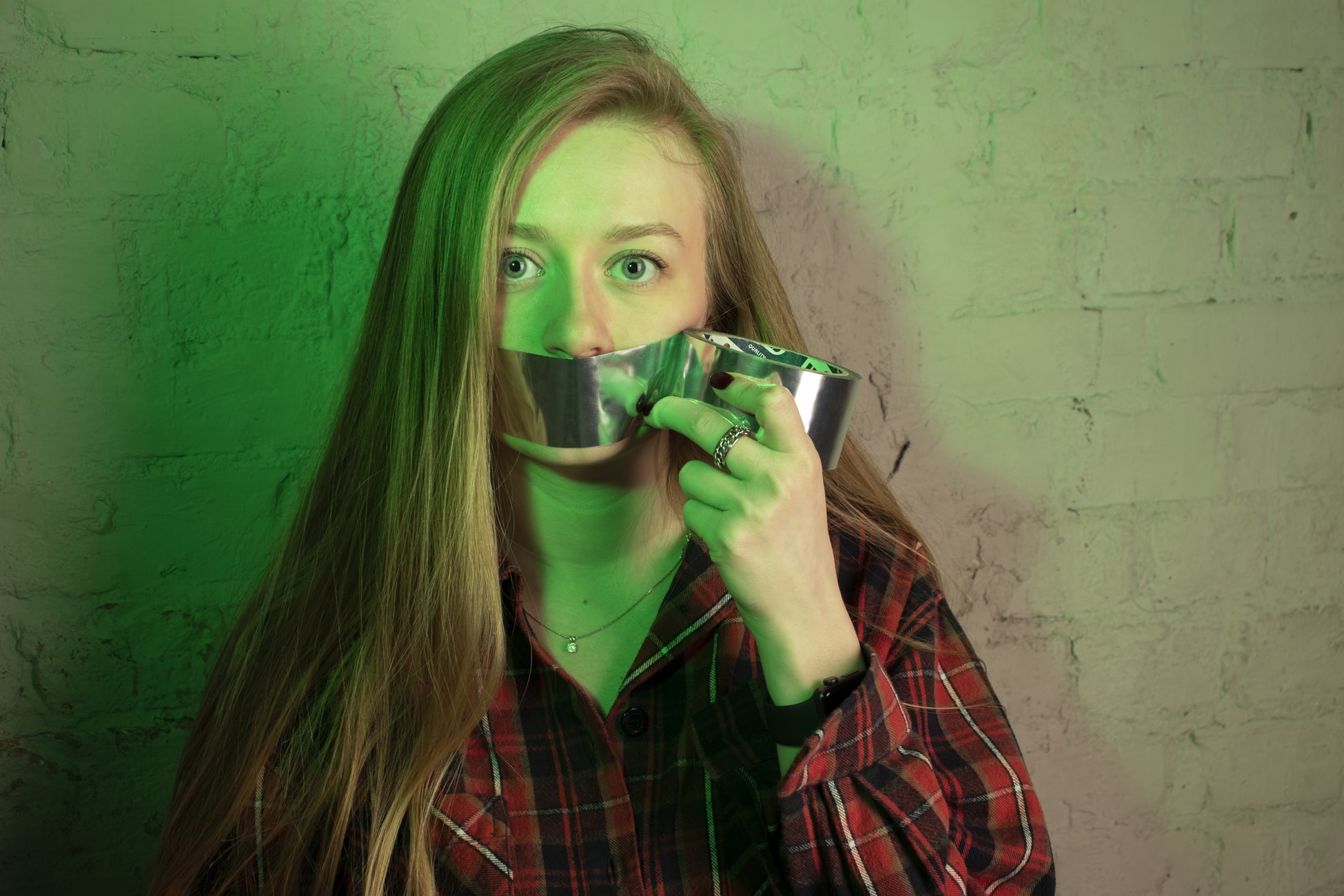 woman with tape on mouth